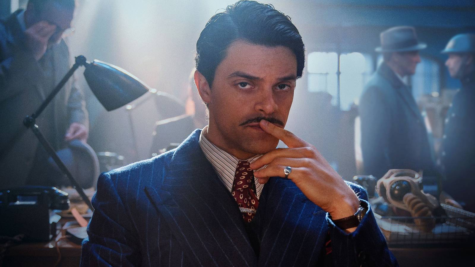 Jacob Fortune-Lloyd as Charles Whiteman putting a finger to his lips in Bodies.