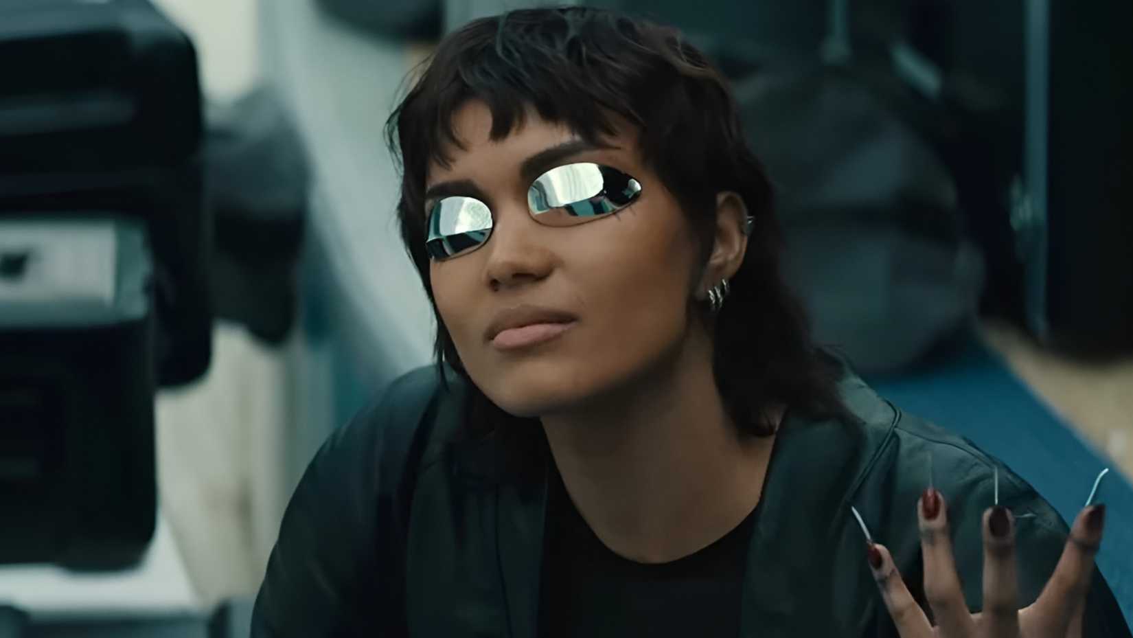 Briana Middleton’s Molly Millions showing her cybernetic nails in Apple TV’s Neuromancer
