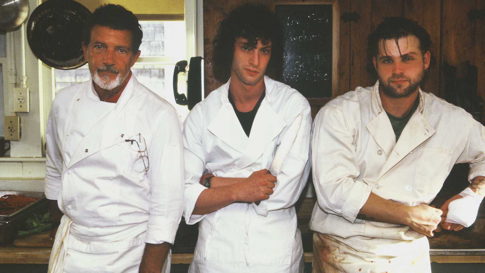 Chef, Tony and Sal posing for a photo in their kitchen whites