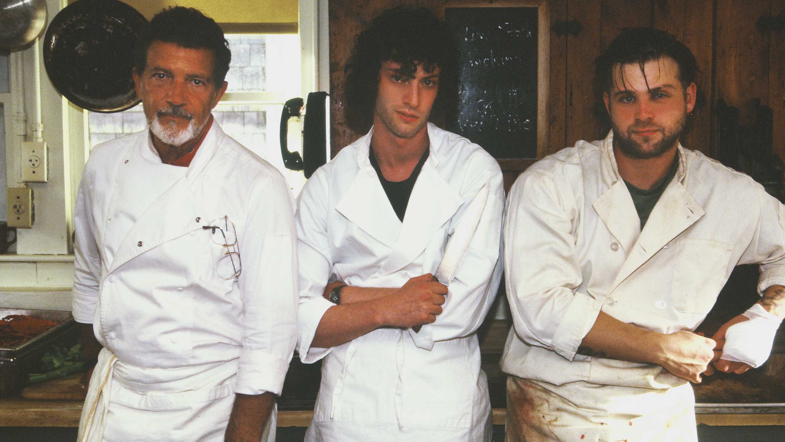 Chef, Tony and Sal posing for a photo in their kitchen whites