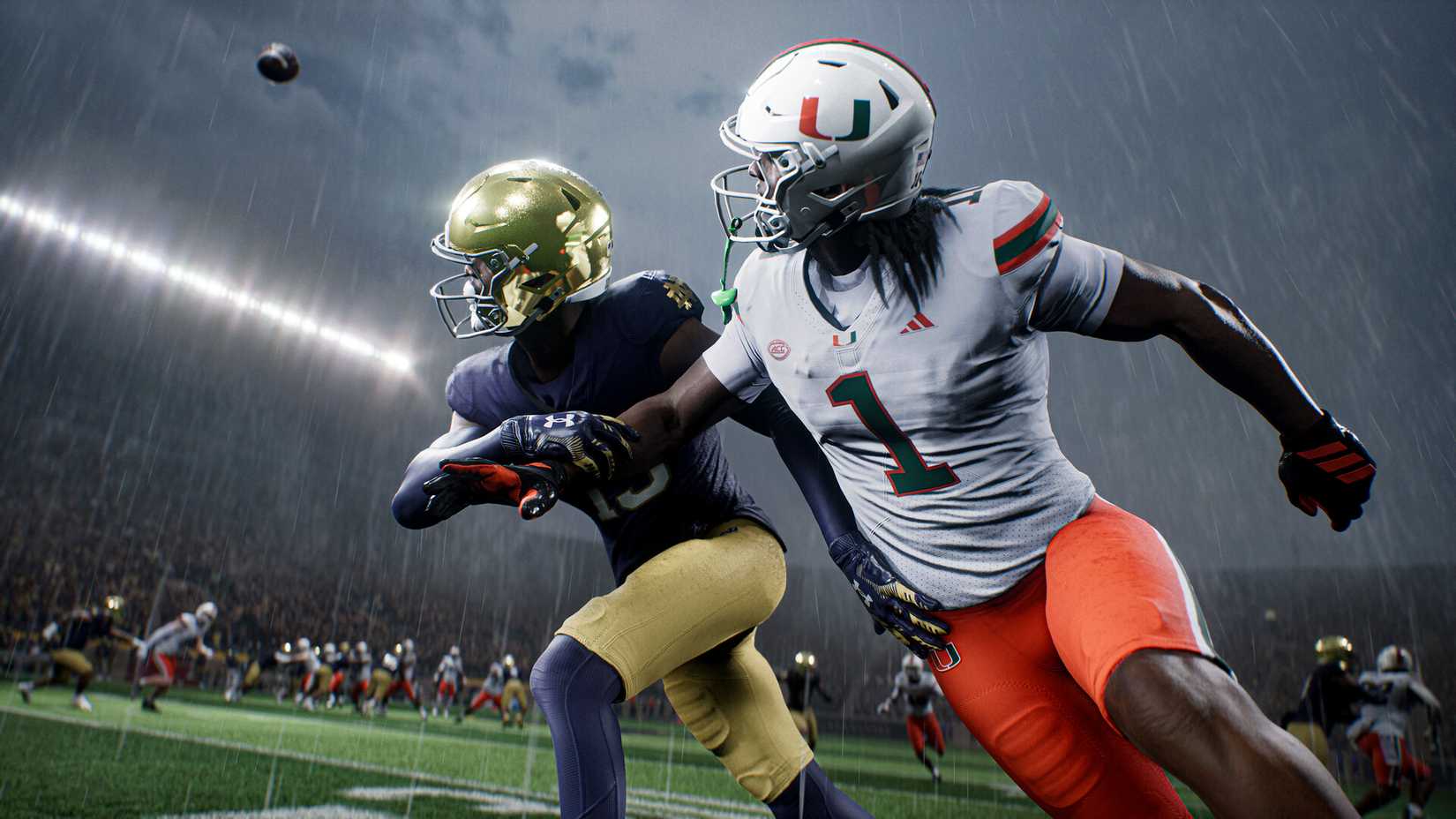 A Notre Dame secondary defender running with a Miami receiver as a pass comes in.