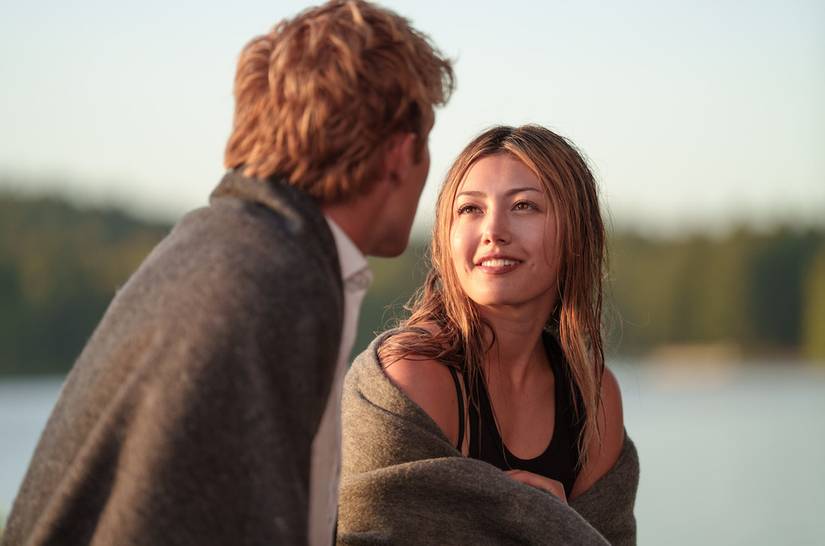 A young girl smiling at a boy in Crew Girl Netflix 9