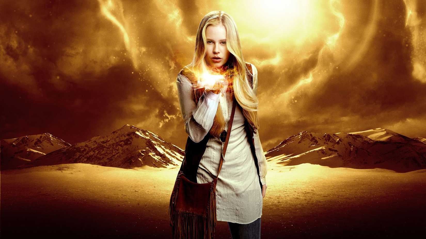 Heroes Reborn promo picture of Malina Bennet with yellow-colored mountain background