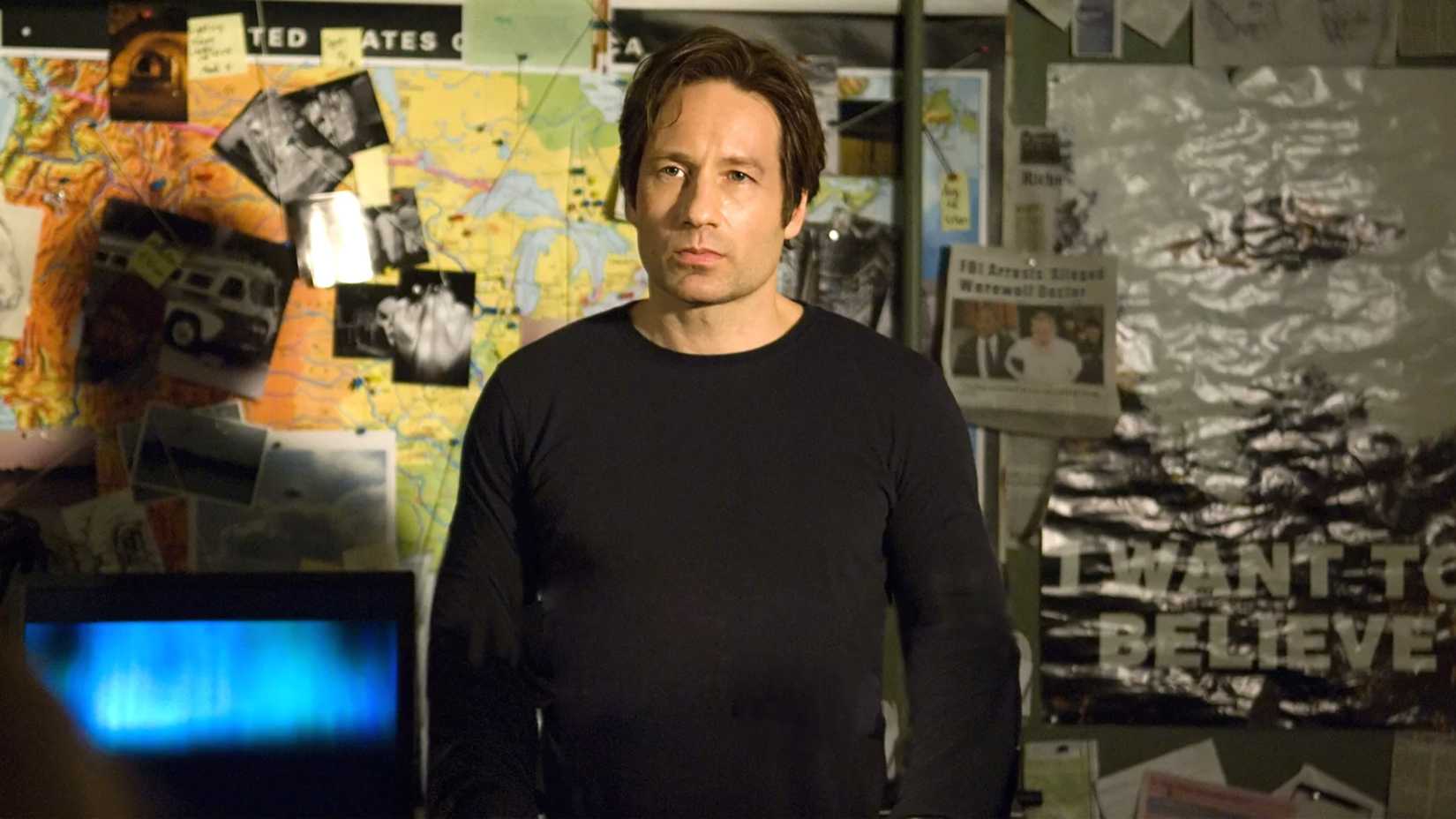 David Duchovny's Mulder looking upset while standing in his office in The X-Files: I Want To Believe