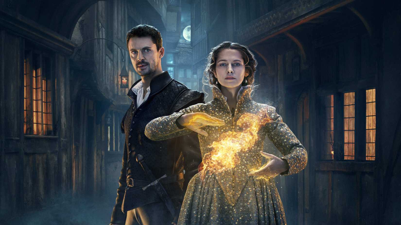 In a promotional photo of A Discovery of Witches season 2, Diana Bishop and Matthew Clairmont stand in an allyway as Diana conjurs a fire ball