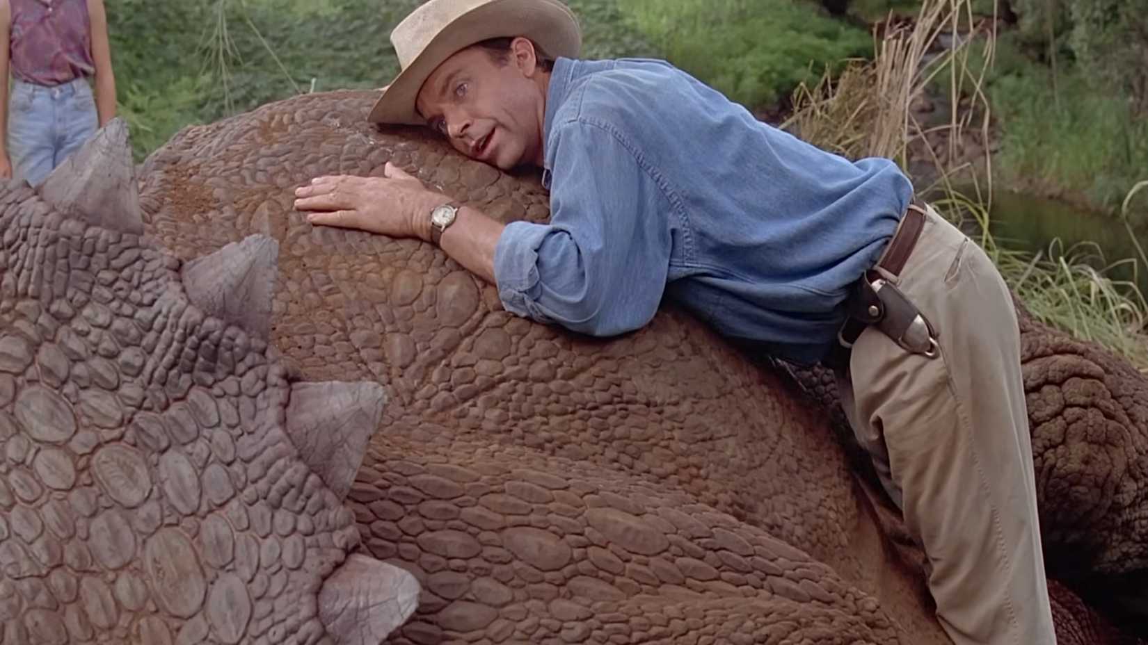 Dr Grant (Sam Neill) listening to a triceratops breathing in Jurassic Park