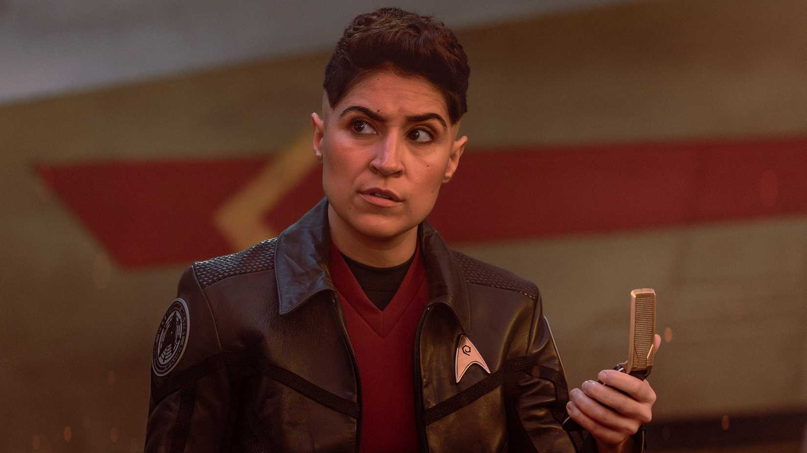 Erica Ortegas holding a communicator in Star Trek Strange New Worlds season 4 episode 1