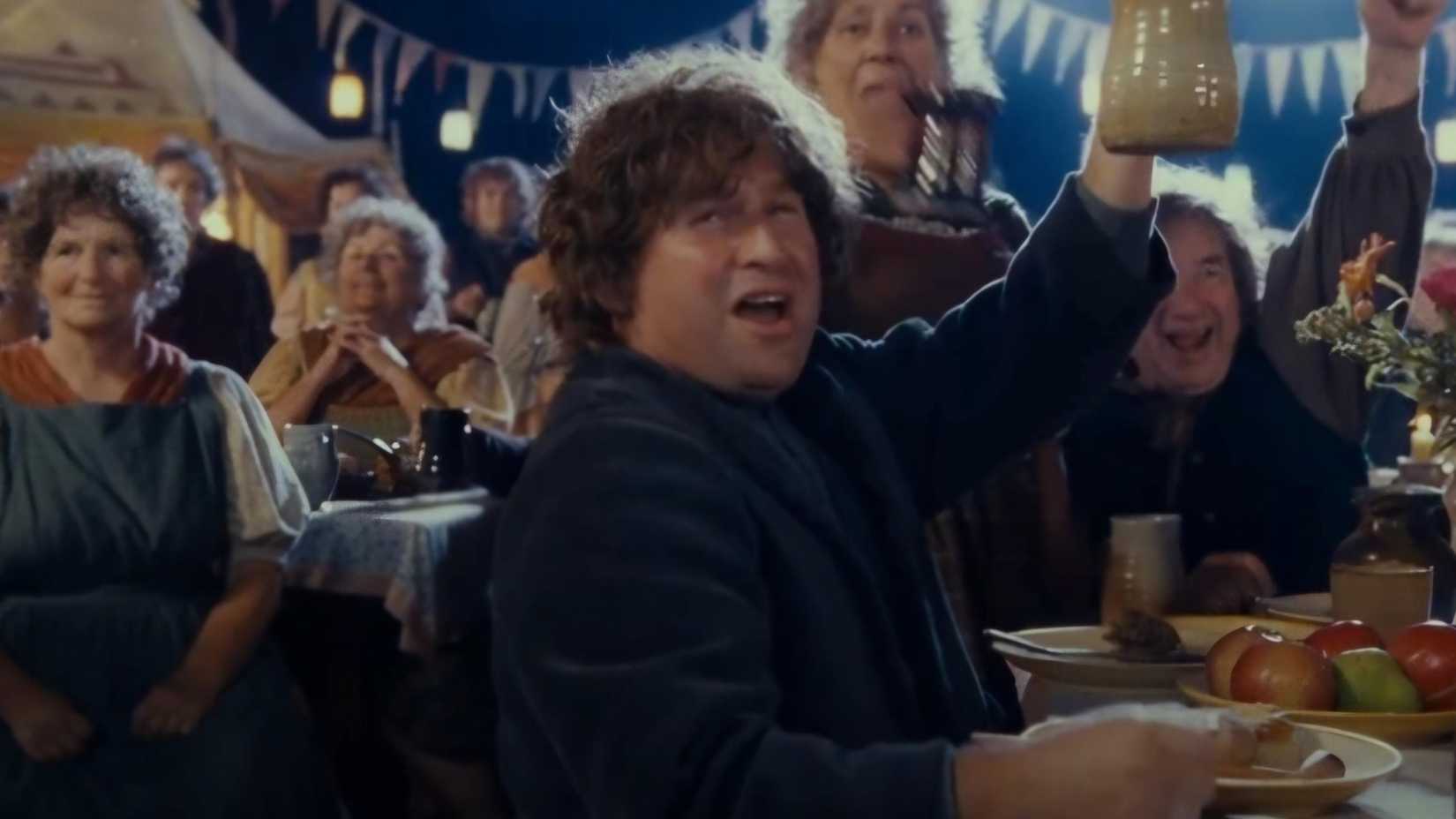 Fatty Bolger raising a glass in The Lord of the Rings The Fellowship of the Ring.