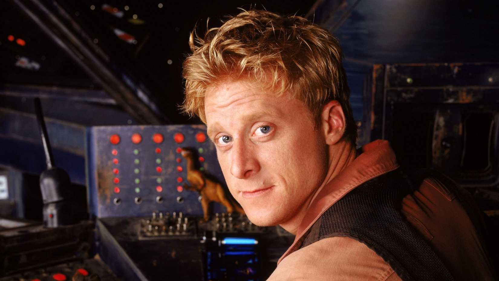 Hoban Washburne (Alan Tudyk) sitting at the Serenity's cockpit in Firefly