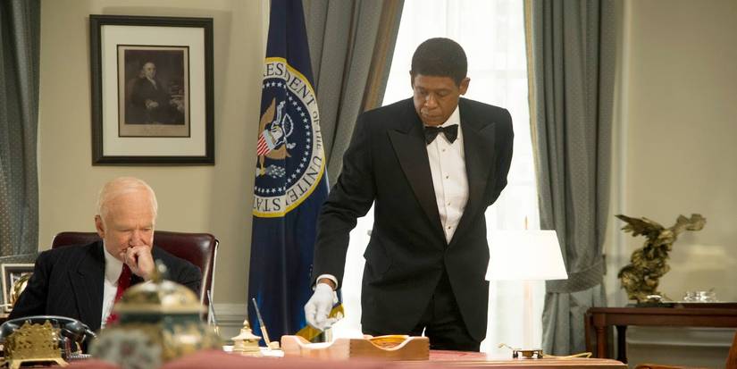 Forrest Whitaker as Eugene laying a table in The Butler