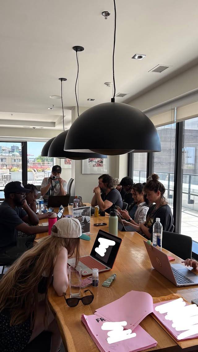 From cast gathered around a table for season 5