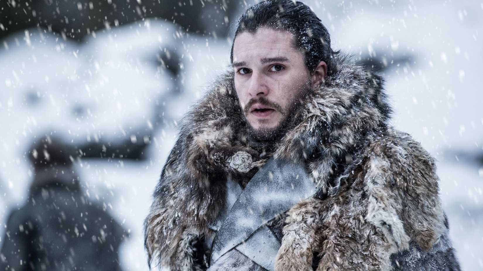 Jon Snow covered in snow and furs in Game of Thrones