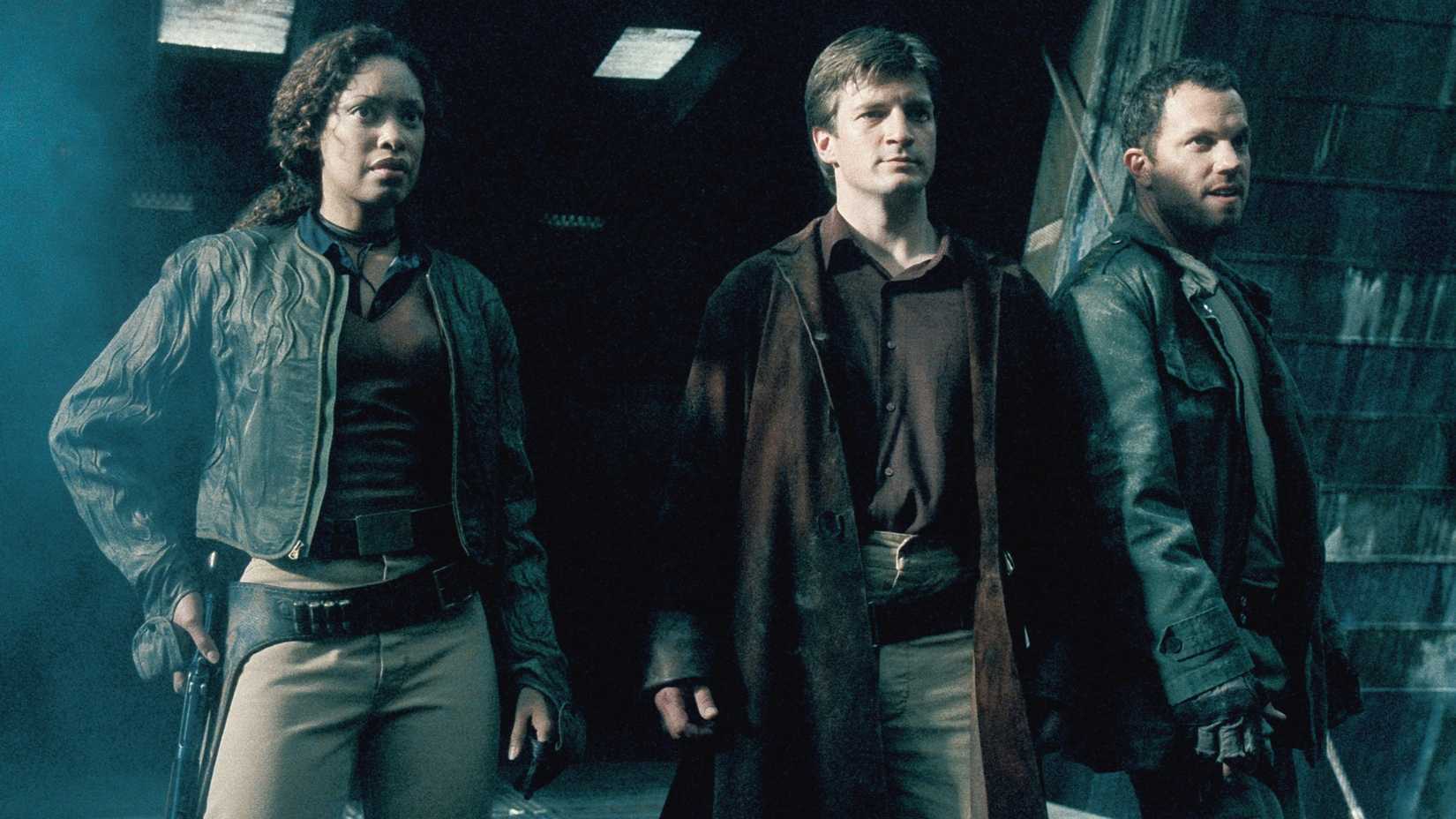 Gina Torres, Nathan Fillion, and Adam Baldwin in Firefly