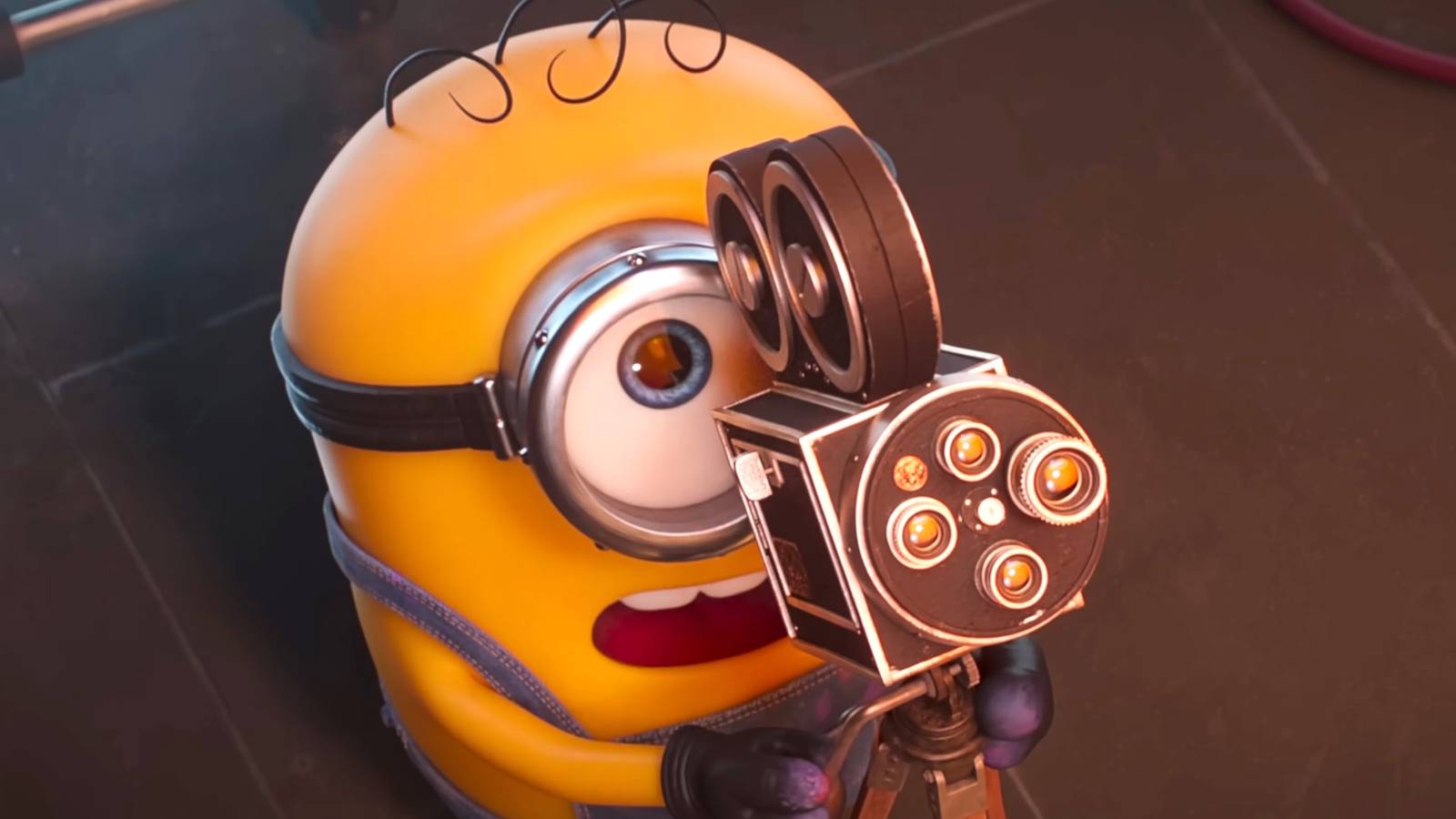 James looking up in shock while pointing a camera in Minions & Monsters