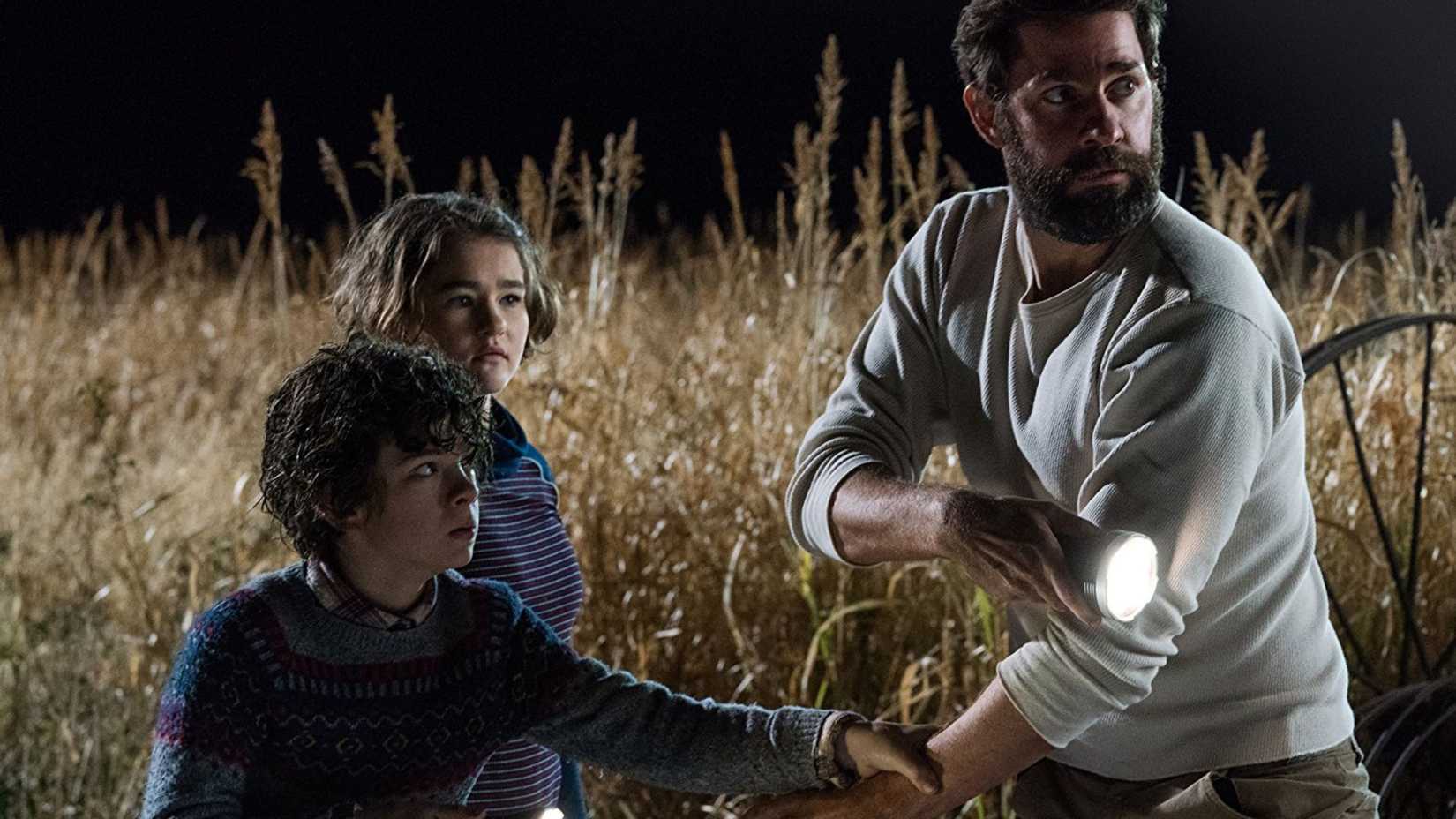 John Krasinski with a flashlight in A Quiet Place