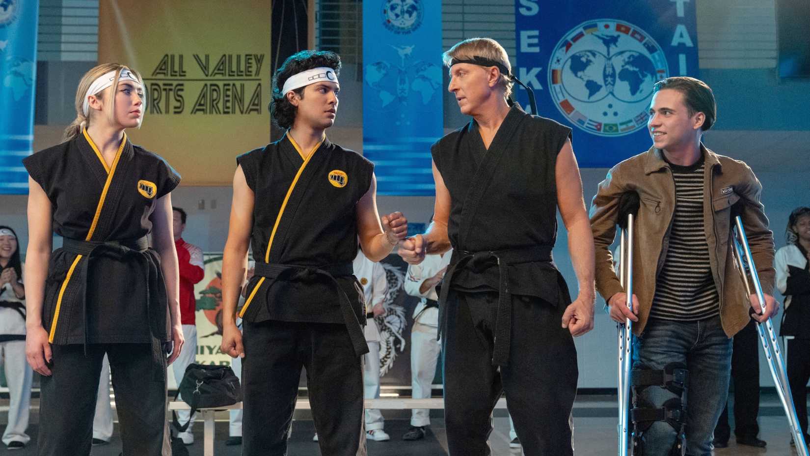 Johnny Lawrence and Miguel Diaz fist bumping in Cobra Kai
