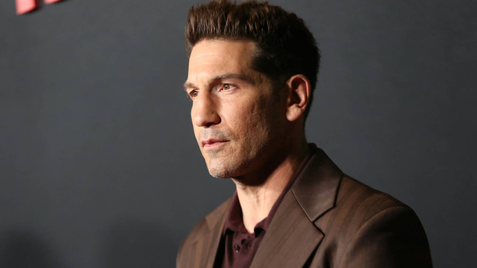 Jon Bernthal posing on The Unforgivable red carpet