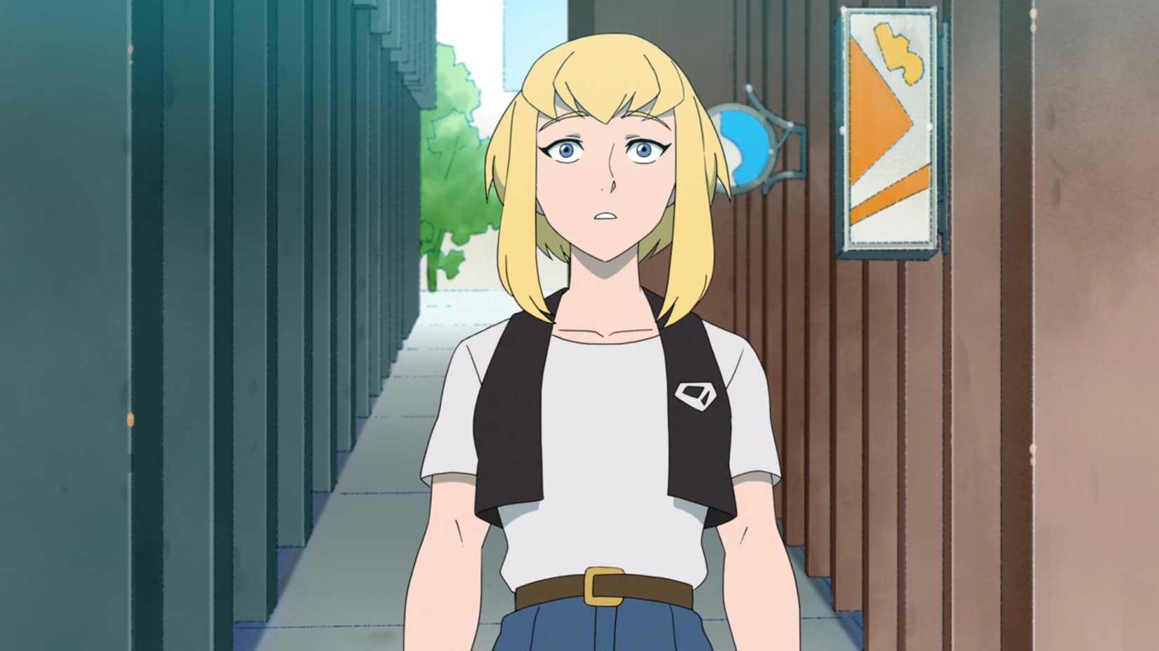 Kara Zor-El looking up with wonder at Metropolis while on a street sidewalk