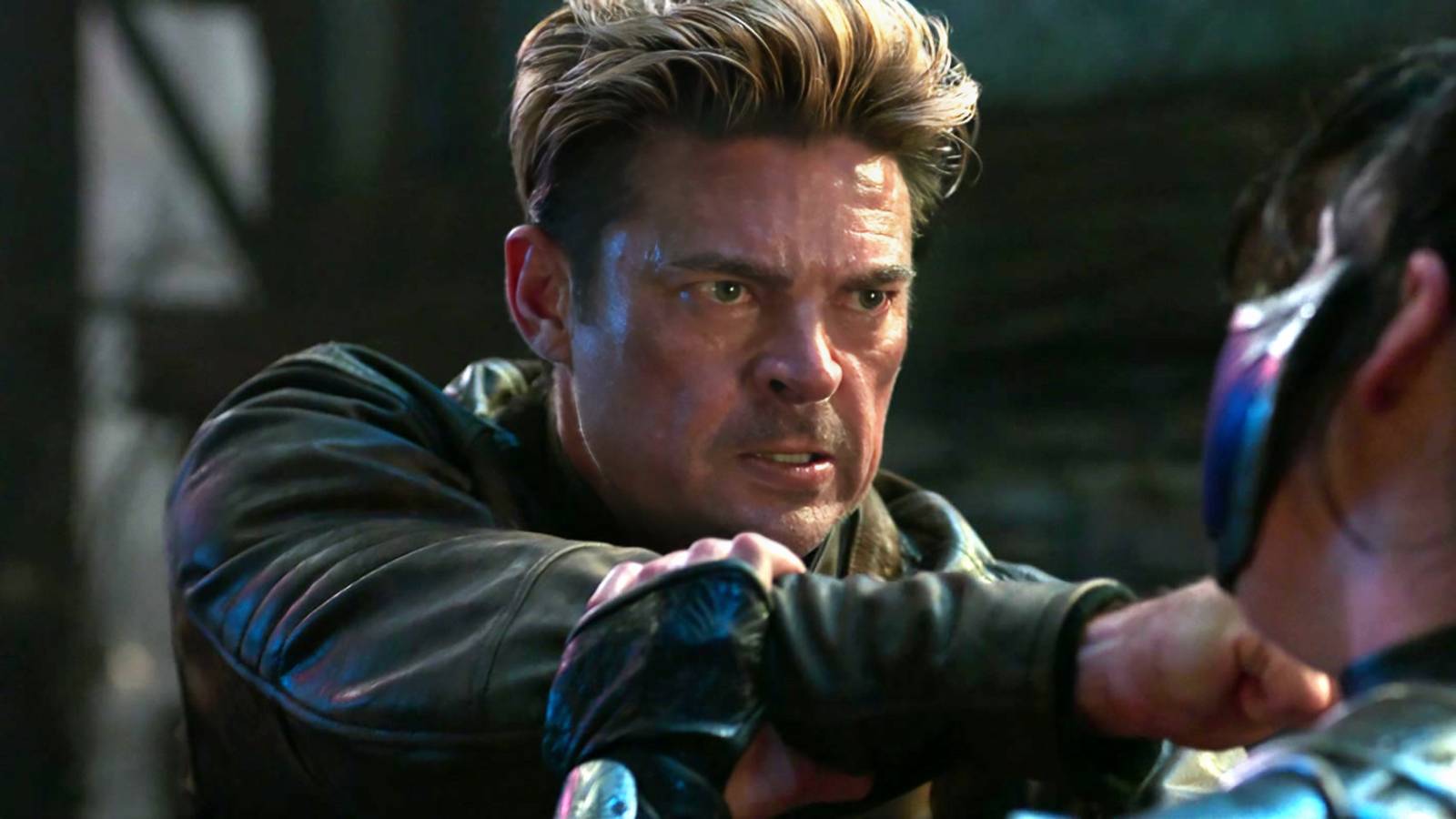 Karl Urban's Johnny looking shocked as his arms are held by Kitana in Mortal Kombat II