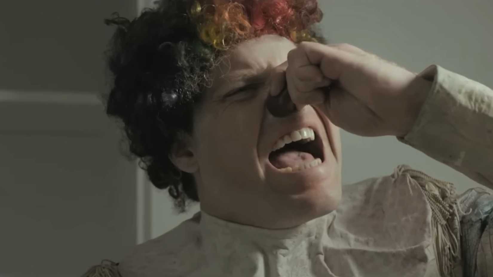 Kent trying to rip his costume nose off in Clown