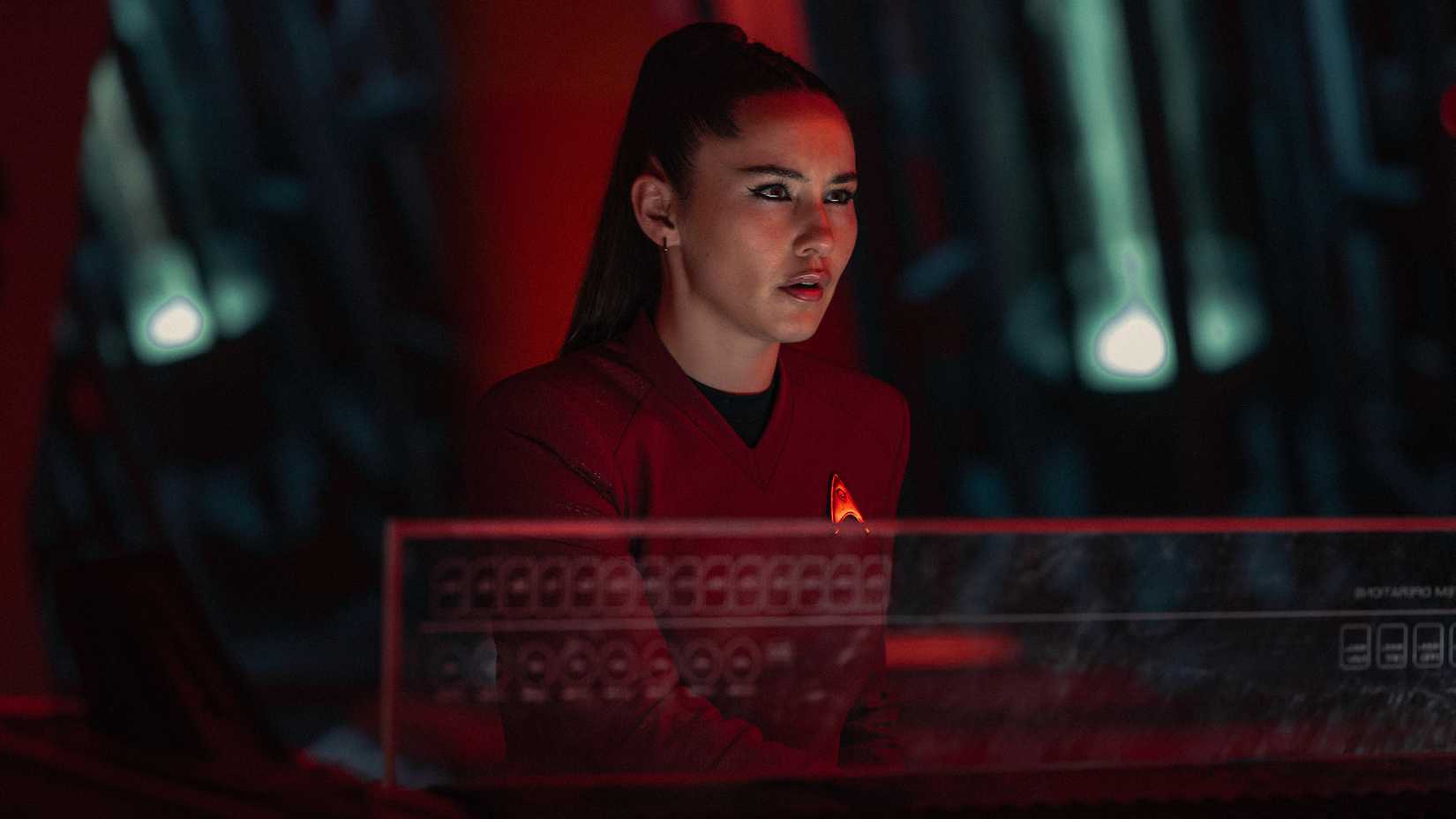 La'an at a console looking intense