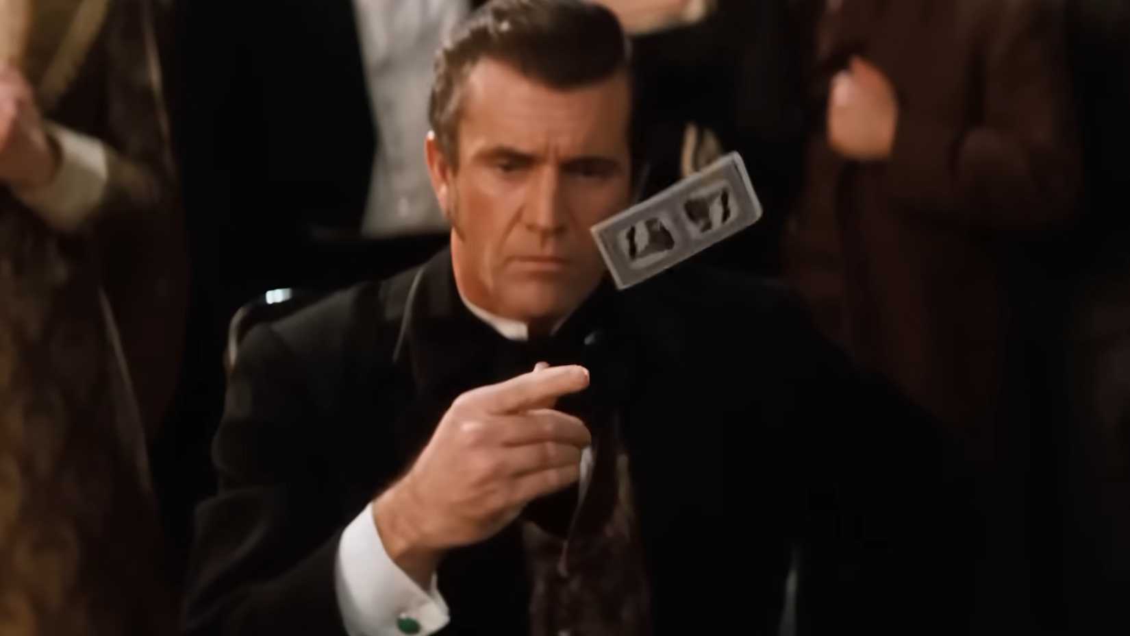 Mel Gibson throwing a playing card in Maverick