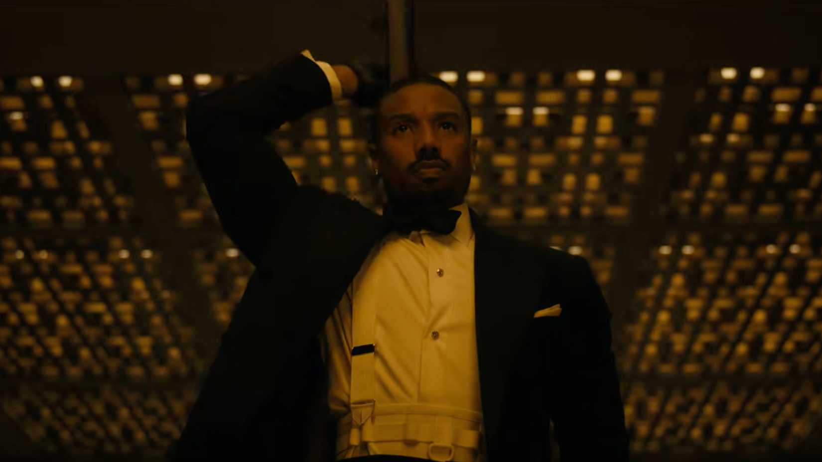 Michael B Jordan as Thomas Crown stealing an art piece in The Thomas Crown Affair