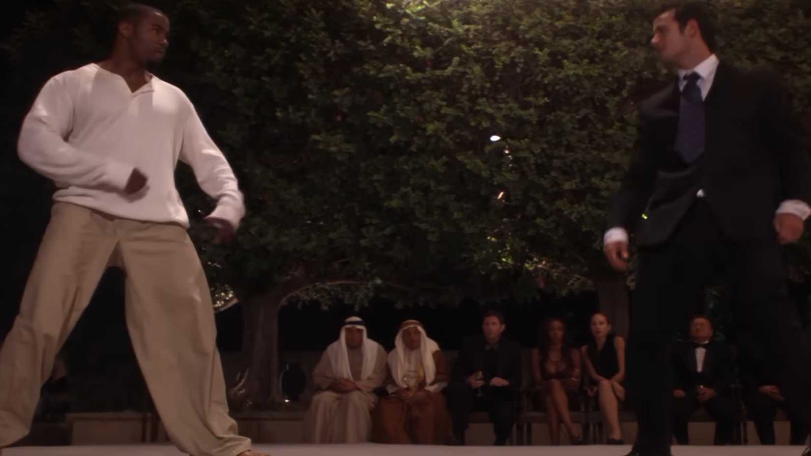 Michael Jai White fighting an opponent in a suit in Blood and Bone
