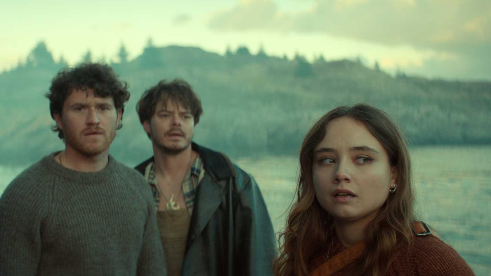 Netflix's Below characters looking concerned while standing by the water