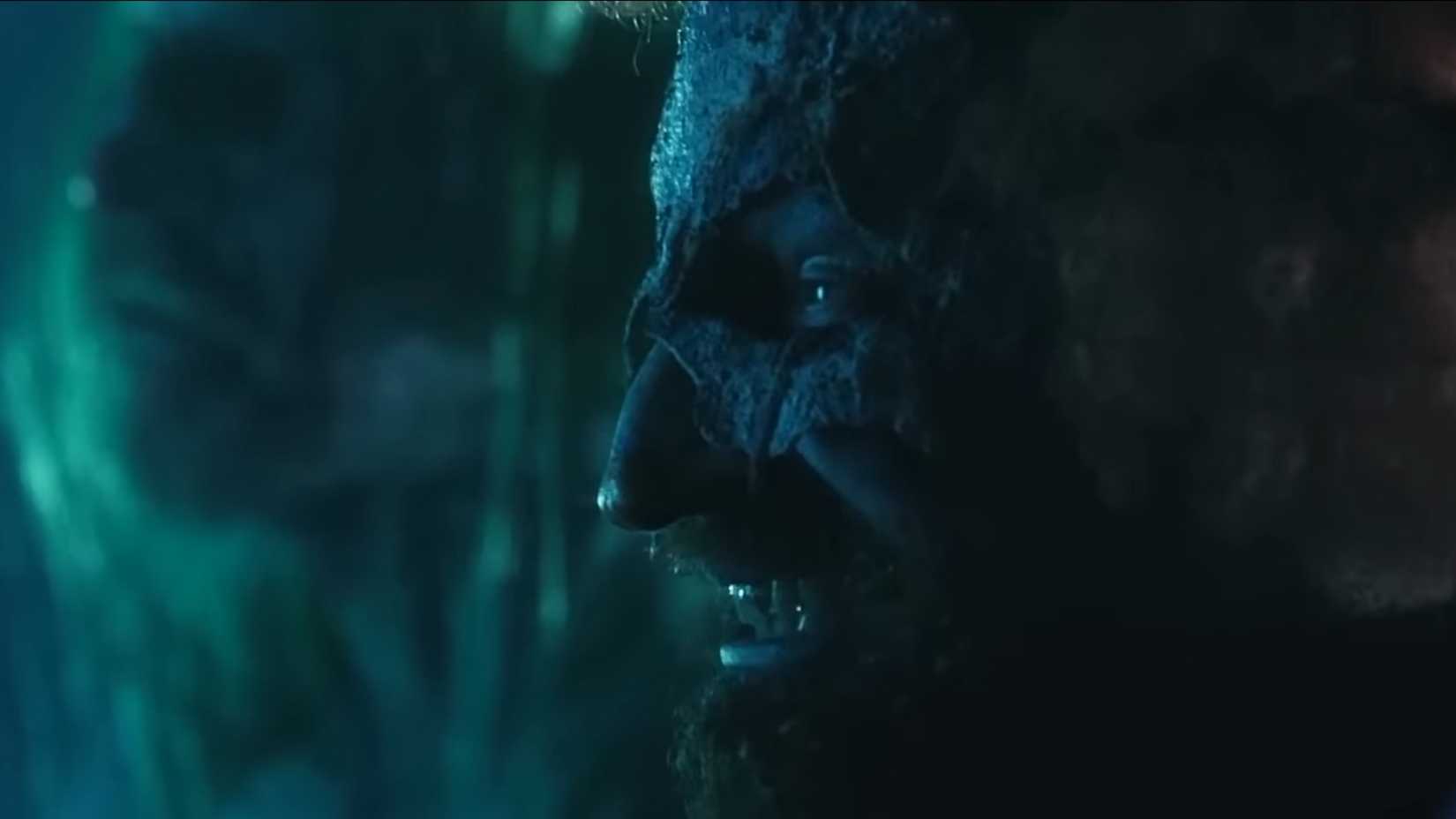 One of the clowns in 31 grinning at the terrified survivors