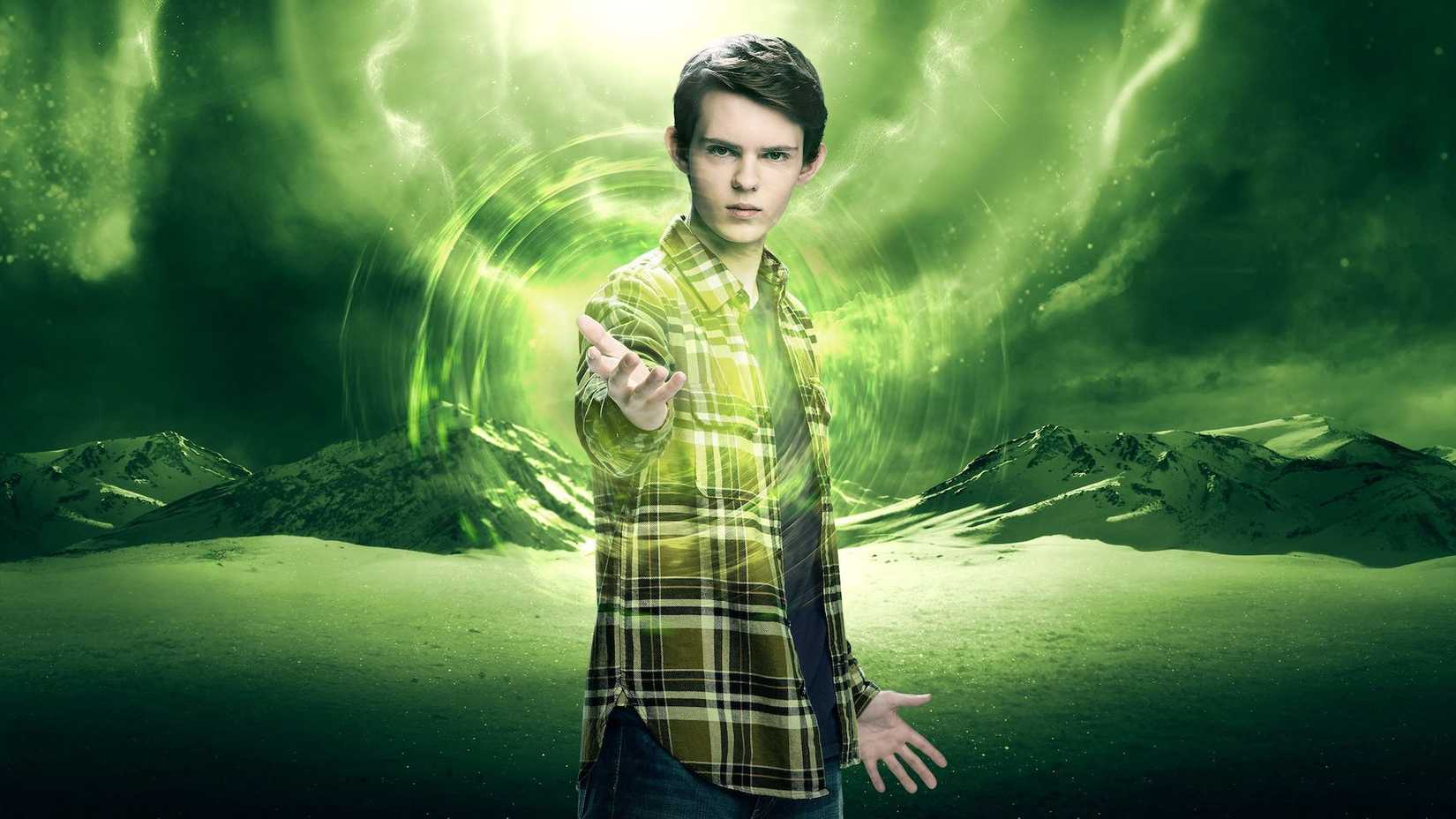 Heroes Reborn promo picture of Tommy Clark with a green-colored mountain background