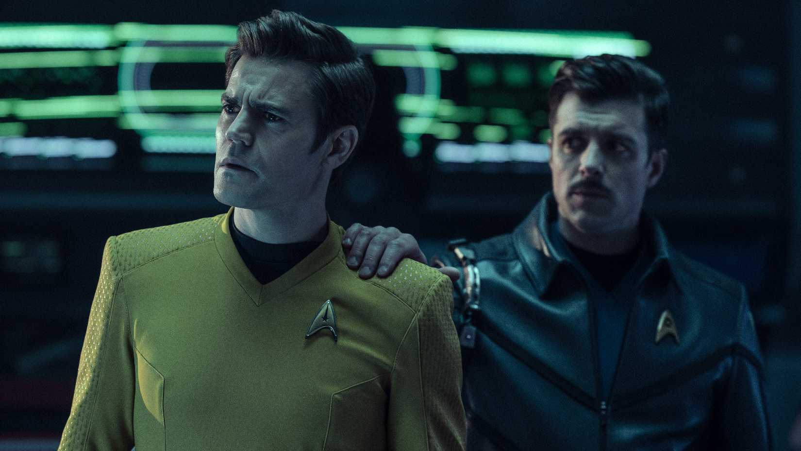 Sam Kirk's hand on Jim Kirk's shoulder