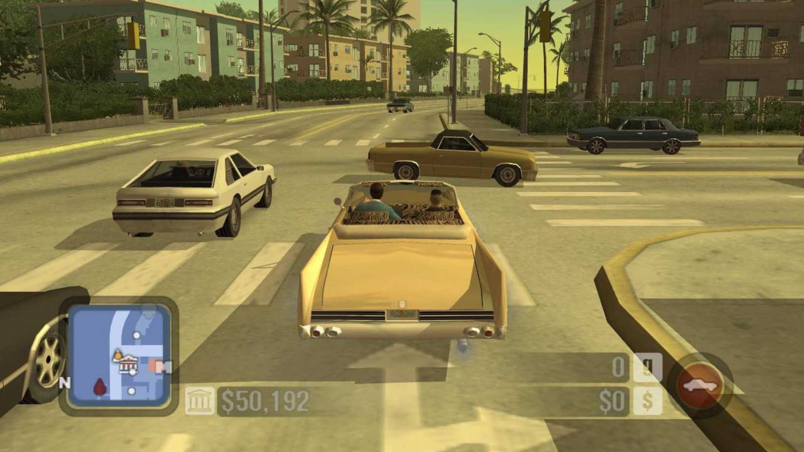 The player driving down a busy road in Scarface.