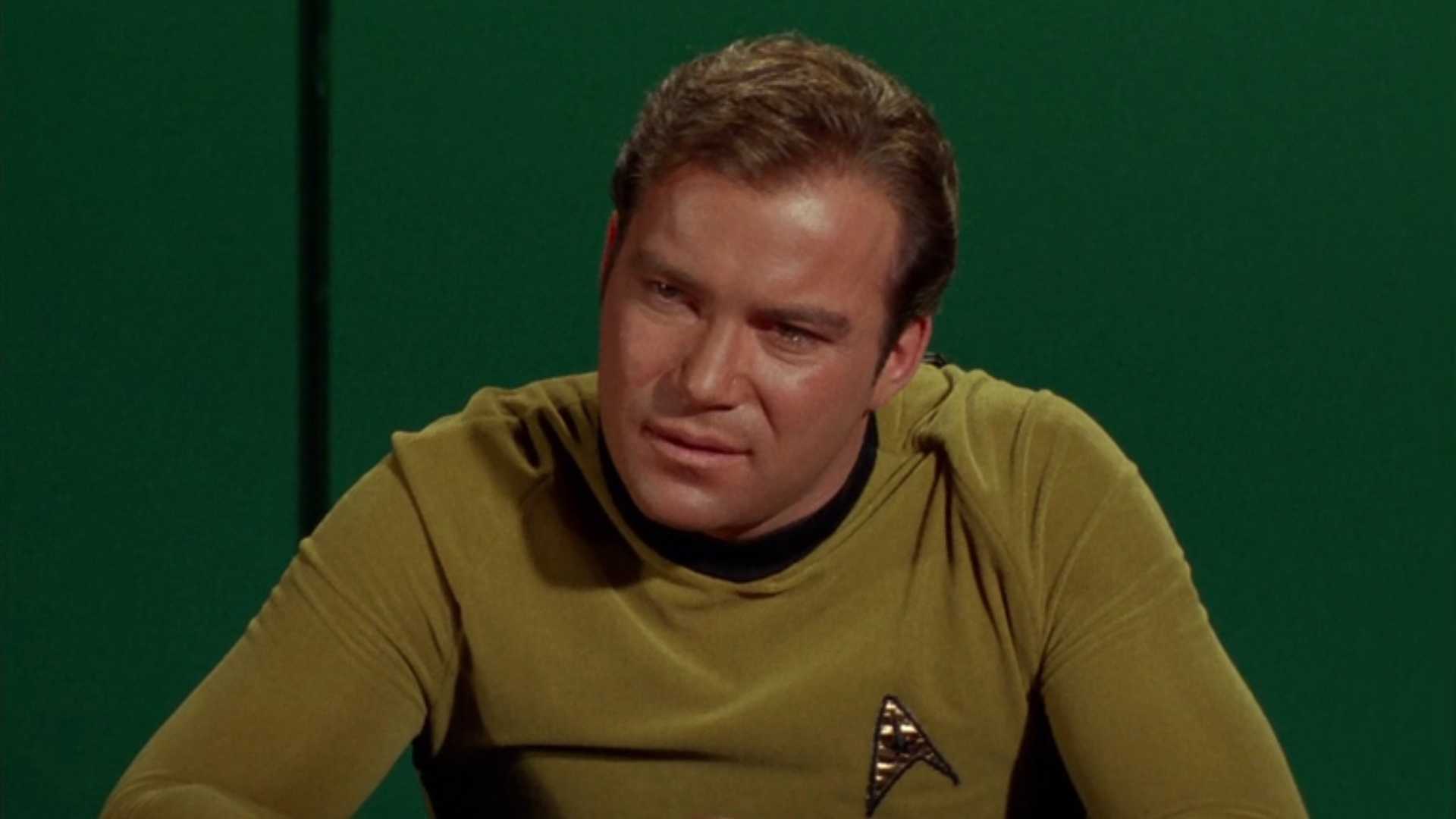 Kirk giving passionate speech in an Enterprise meeting room