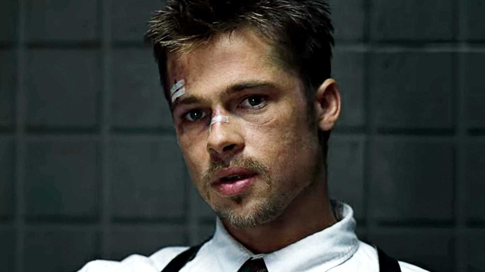 Brad Pitt looks on with a bandaged face in Seven