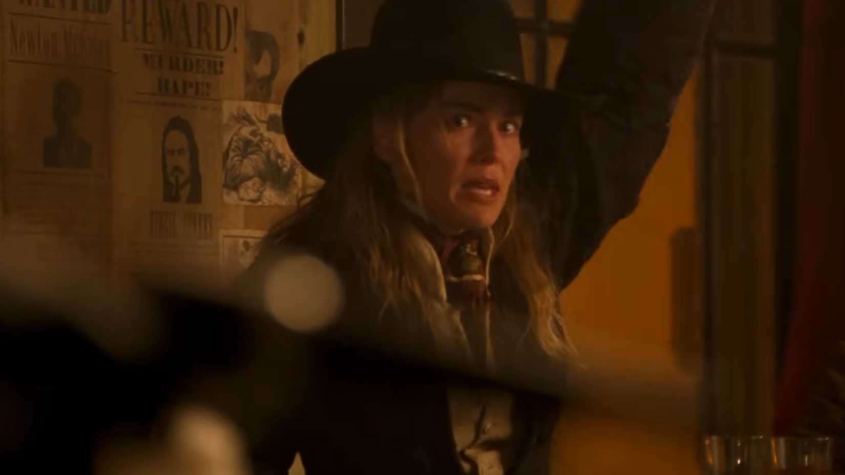 Sharon Stone raises her hand to be counted in the quickdraw competition in the quick and the dead