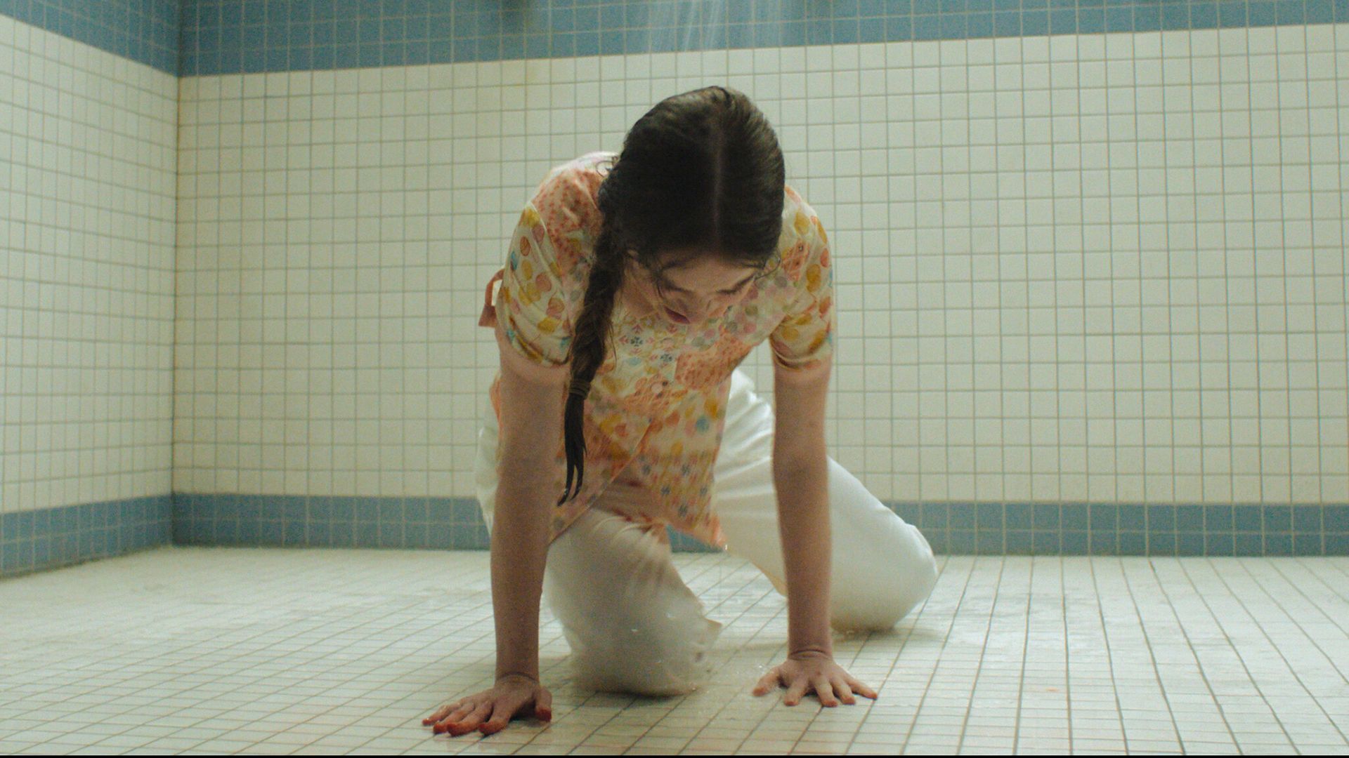 Summer H. Howell's Carrie crying while laying on the shower floor in Carrie