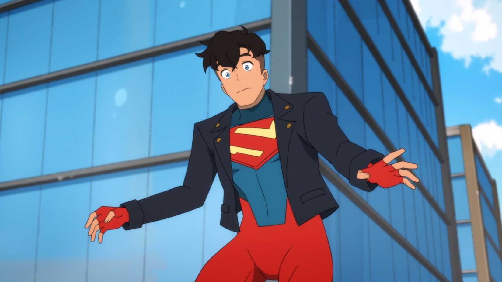 Superboy hovering midair with a worried expression on his face