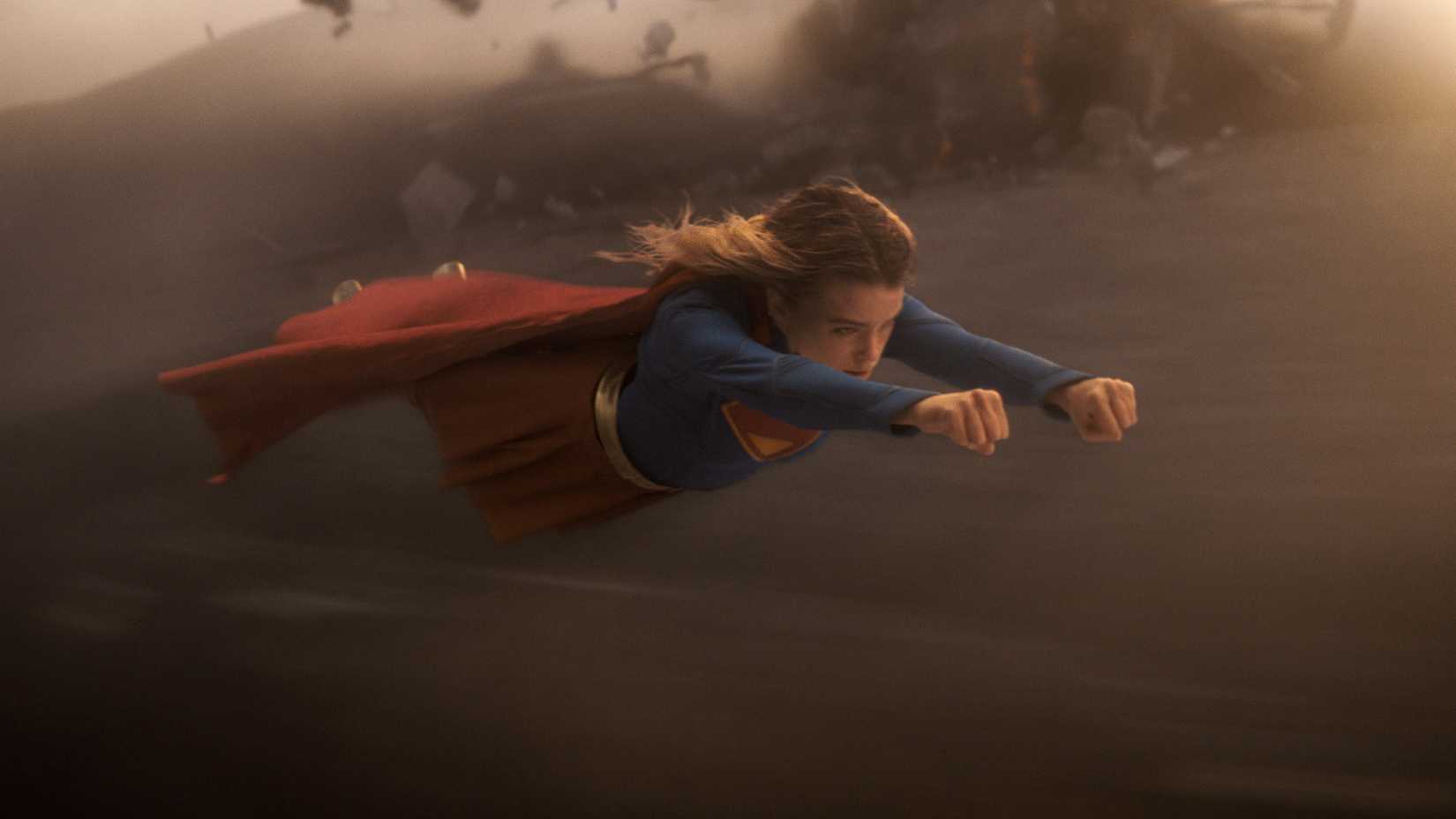 Supergirl (Milly Alcock) flying through the air on an alien planet in Supergirl (2026)