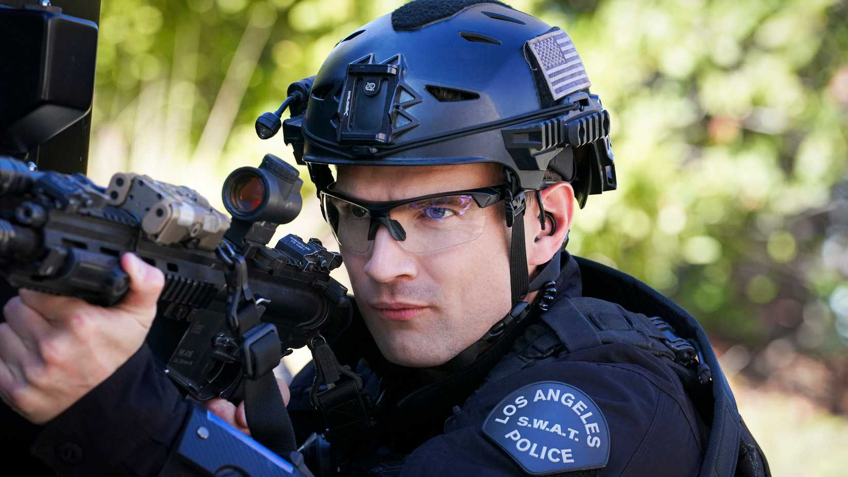 SWAT publicity still of Alex Russell as Jim Street, wearing full tactical gear outdoors.