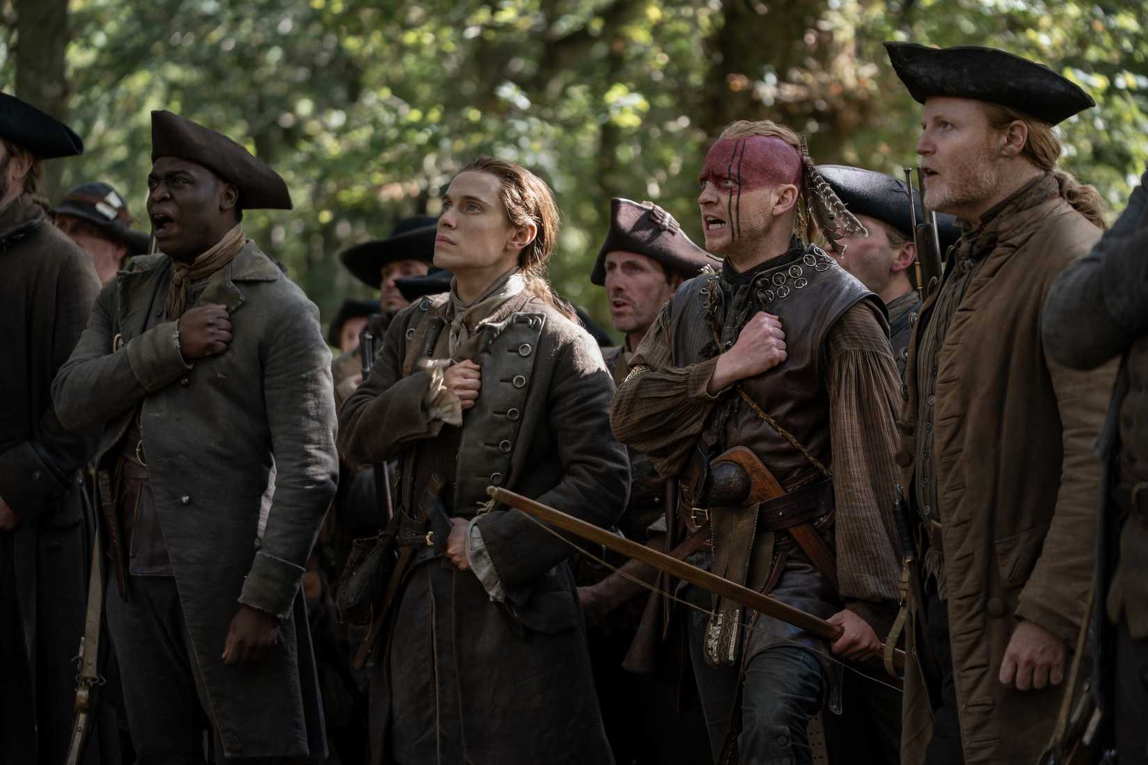 OUTLANDER, from left: Tomisin Ajani, Paul Gorman, John Bell, Gary Lamont, ‘And the World Was All Around Us', (Season 8, ep. 810, aired May 16, 2026). photo: Robert Wilson / ©Starz