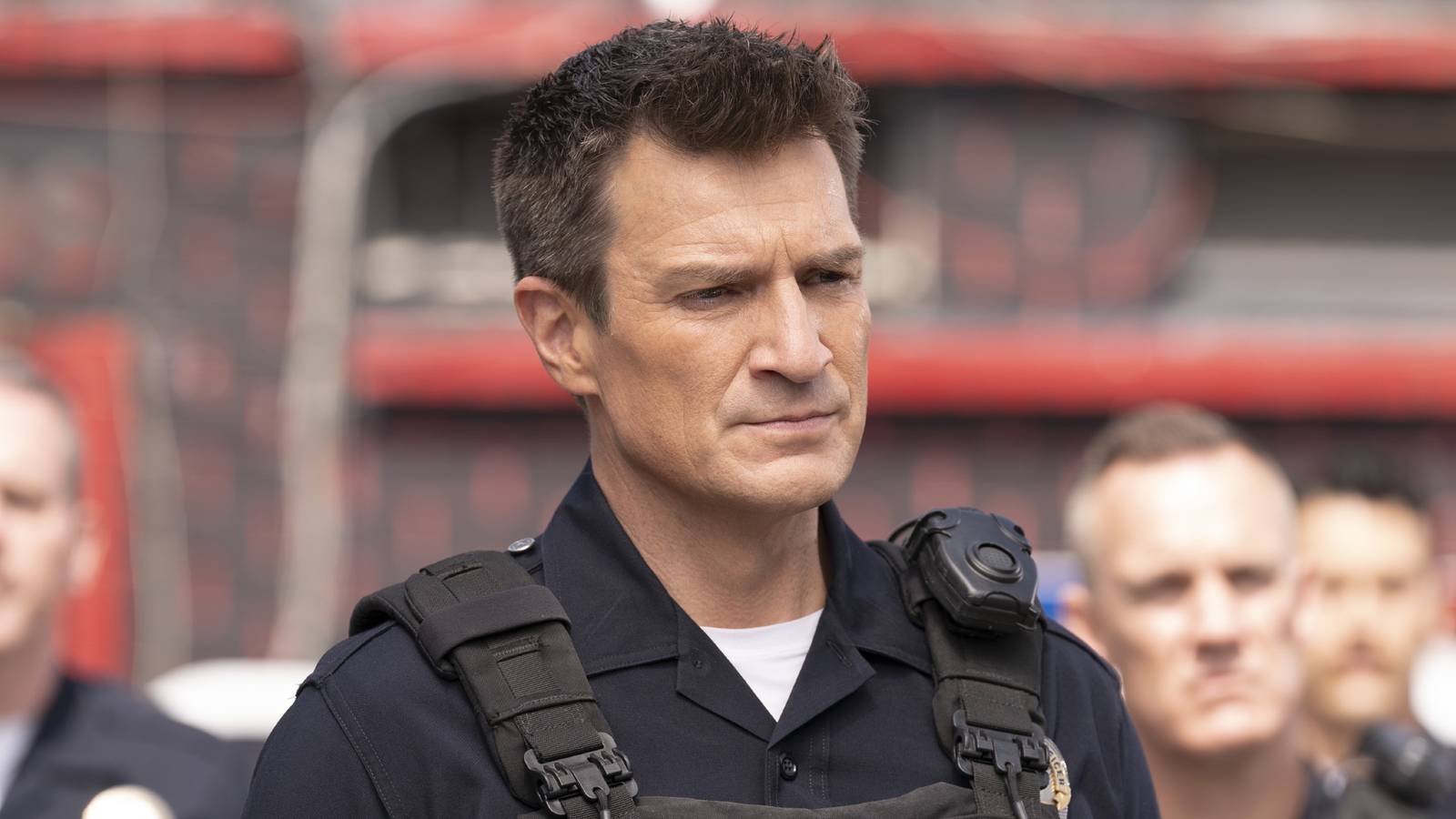 Still of Nathan Fillion as John Nolan wearing his short sleeve uniform and vest in The Rookie.