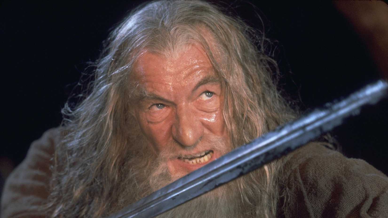 Gandalf (Ian McKellen) wielding a sword in The Lord of the Rings: The Fellowship of the Ring.