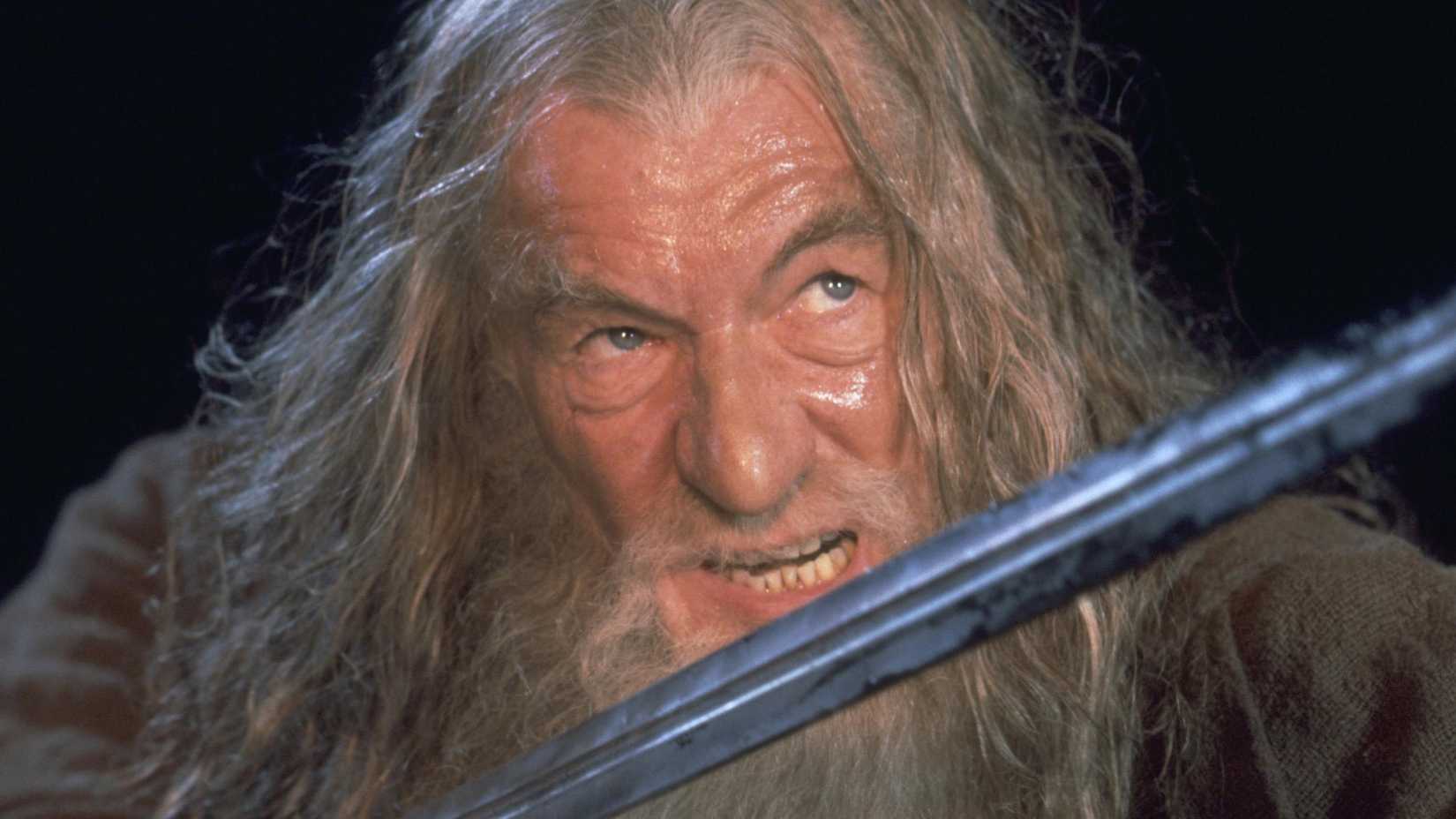 Ian McKellen as Gandalf holding a sword and glaring at the balrog in The Lord of the Rings: The Fellowship of the Rings (2001)