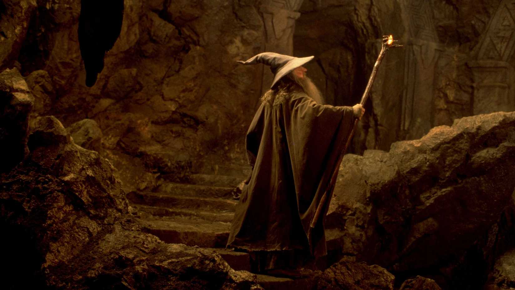 Gandalf (Ian McKellen) raising his staff and lighting a stairwell in The Lord of the Rings: The Fellowship of the Ring.