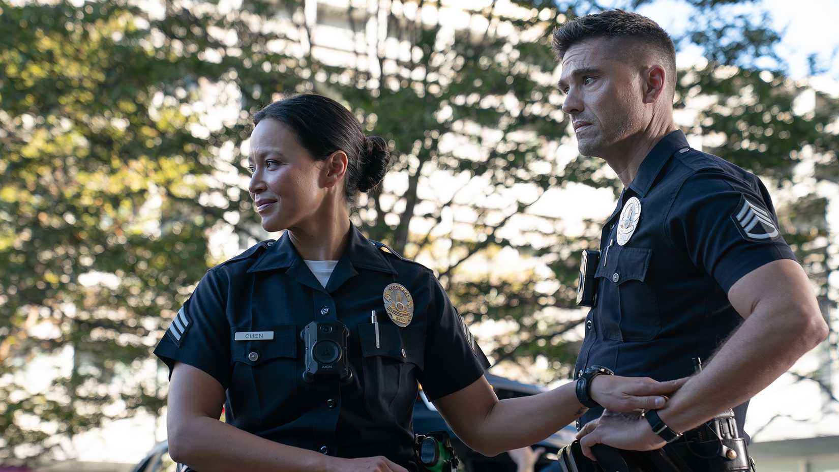 Still of Melissa O'Neil as Lucy Chen and Eric Winter as Tim Bradford in The Rookie season 8 episode 10.