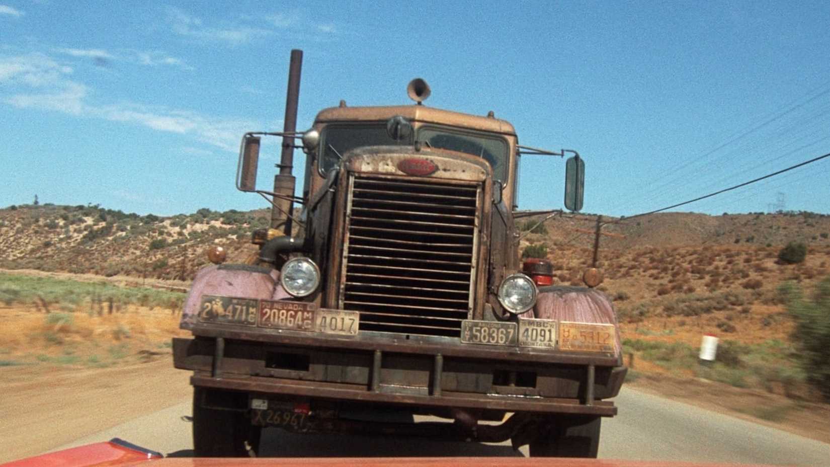 The truck closing in on the desert highway in Duel