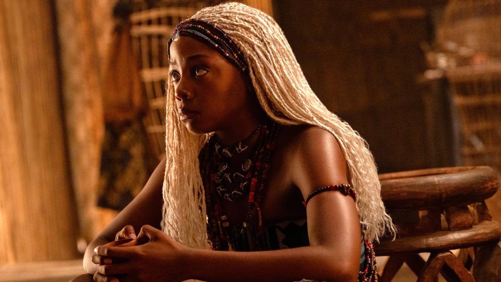 Thuso Mbedu as Zélie sitting down and looking concerned in Children of Blood and Bone