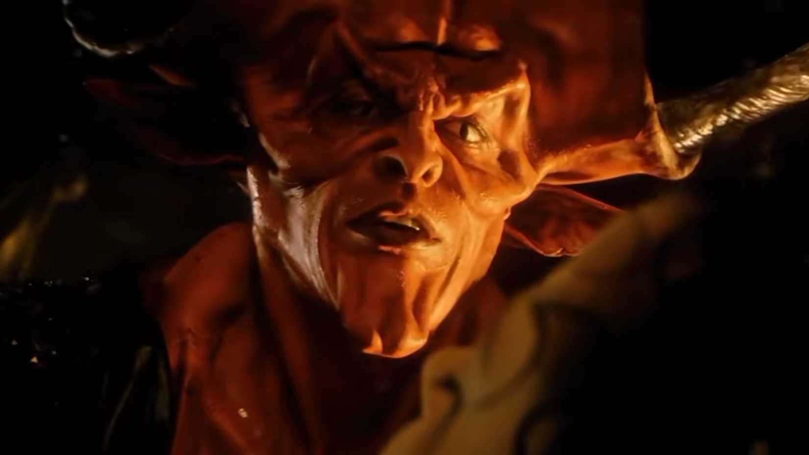 Tim Curry as Darkness standing over Lily in Legend 1985