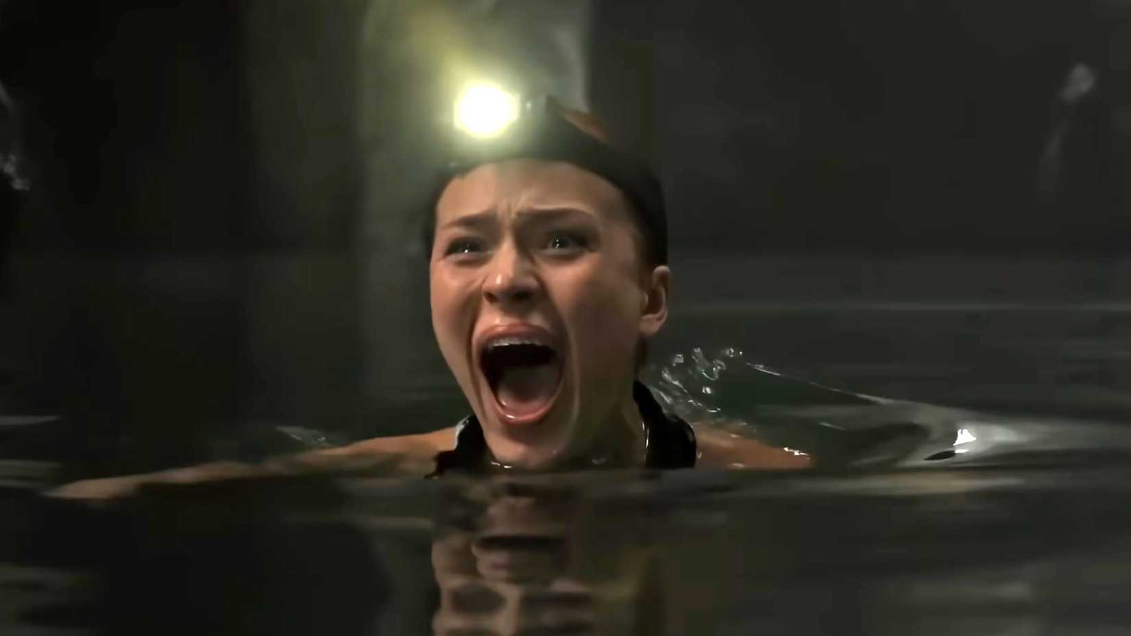 Tommi Rose's Adrienne screaming while in the water in The Devil's Mouth